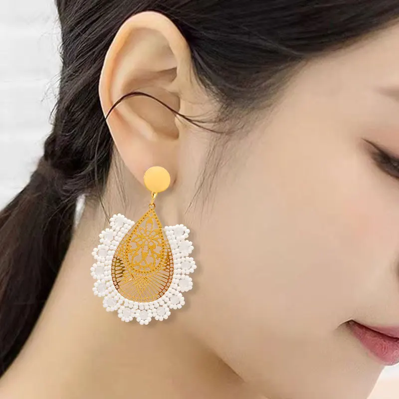 Beaded earrings Hand-woven Hollowed-out Bohemia Alloy Flower Crystal Water drop white Trend Simple female Rice bead earrings