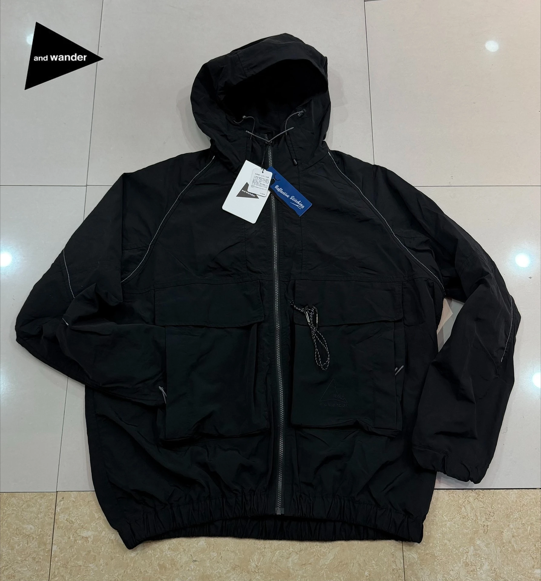 Lightweight Garment  Nylon Hooded Jacket Water Repellent Reflective Stitch Multi Pocket Outdoor Hiking Windbreaker for Men Women