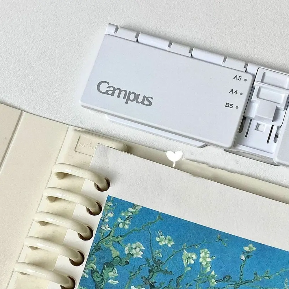 Punzonatrice manuale a 8 fori di alta qualità A5 B5 A4 Strumento per perforare carta Notebook a fogli mobili Leggero raccoglitore ad anelli