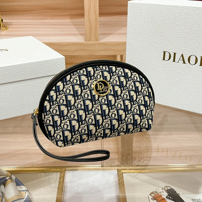 2023 Spring/summer new grip bag advanced sense embroidery printed makeup bag canvas texture hand purse M894