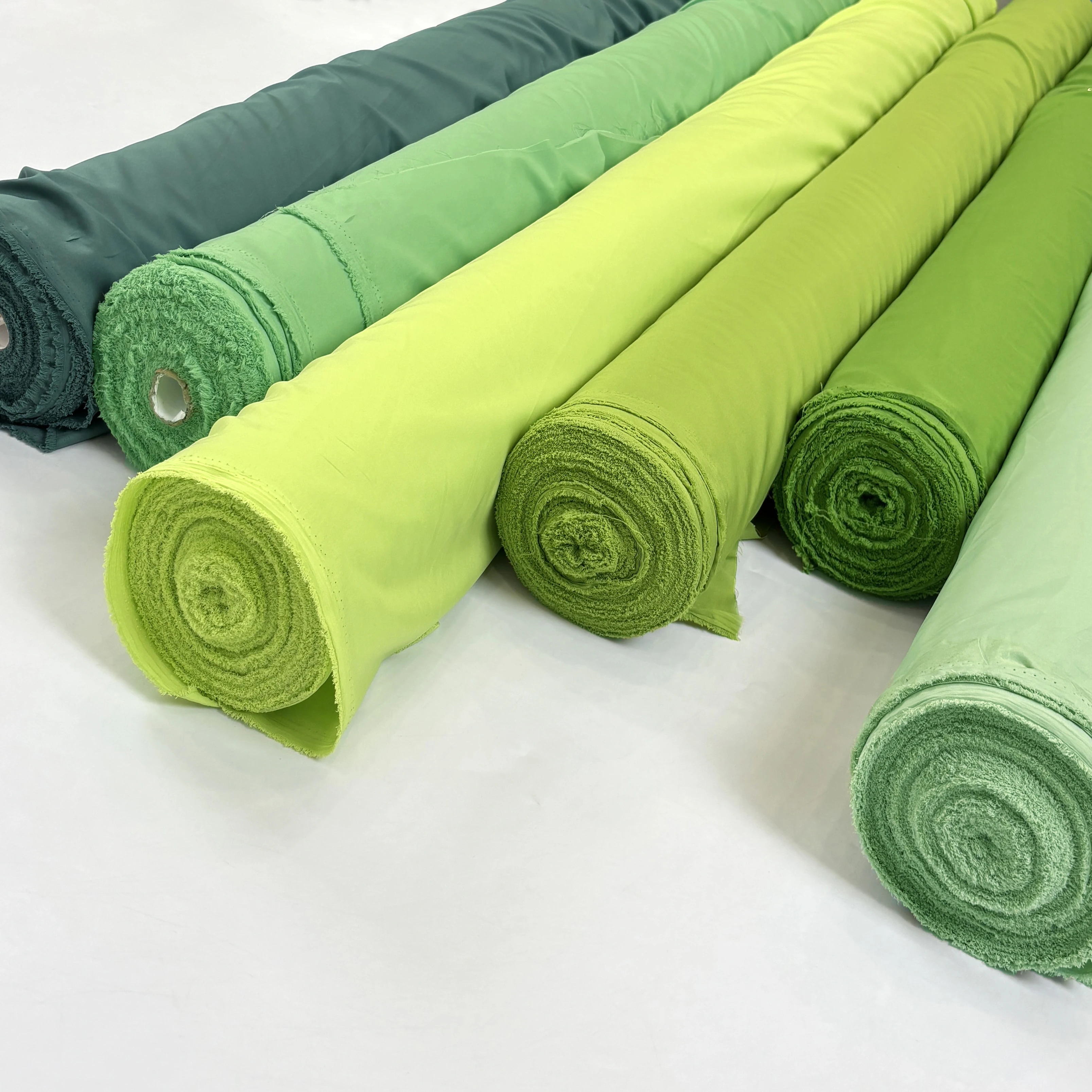 نسيج بطانة مرنة بأربعة جوانب ناعم بالمتر للملابس وسترة وتنورة وستارة مصنوعة يدويًا من القماش العادي باللون الأخضر والأزرق