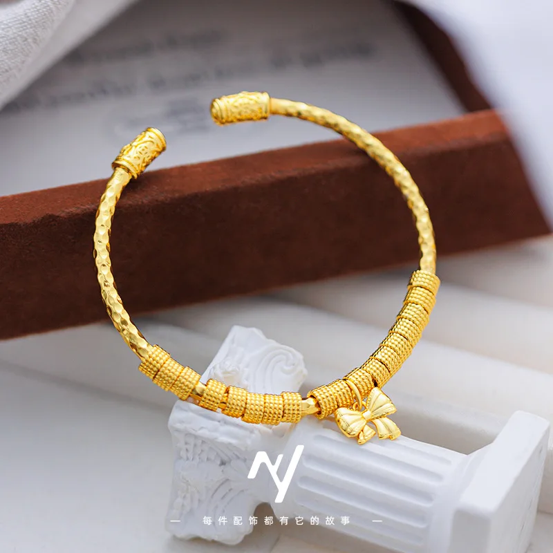 

Wholesale of 999 real gold coiled bow bracelet, women's personalized wristband, open gold store style, new Chinese