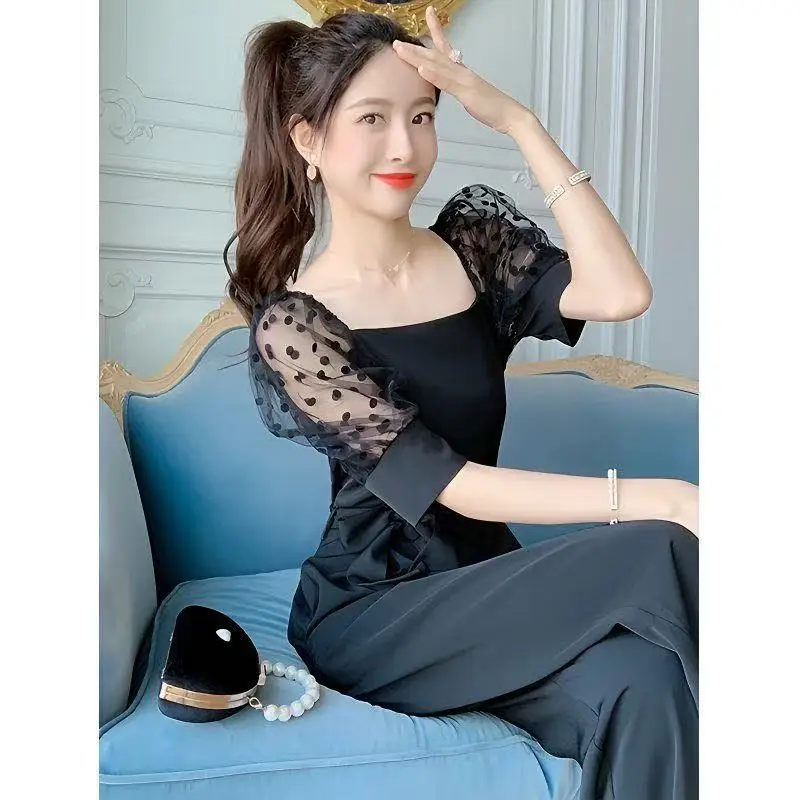 Tuta nera di fascia alta Tuta estiva sottile da donna con maniche a sbuffo Tuta elegante slim con top a tubo lungo