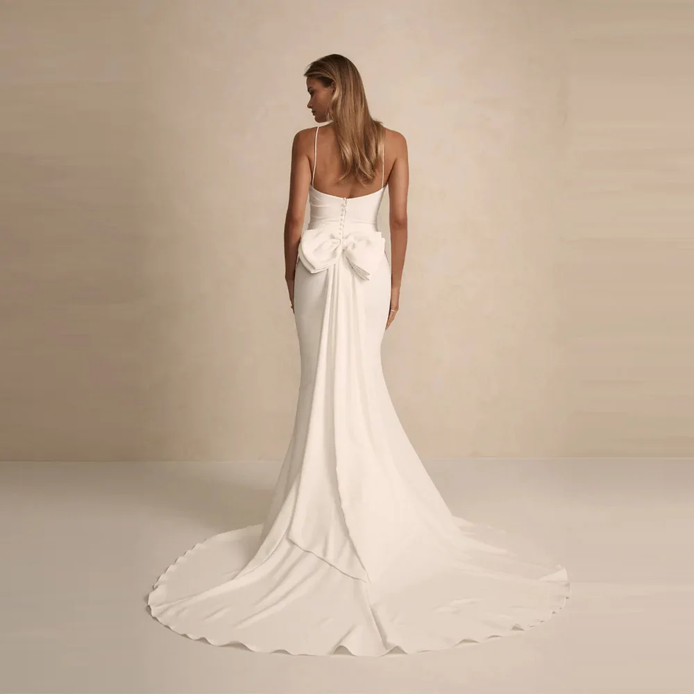 Suknia ślubna syrena w nowoczesnym stylu na zamówienie 2025, elegancka, na ramiączkach spaghetti, z kokardą i guzikami, seksowna suknia dla panny młodej.