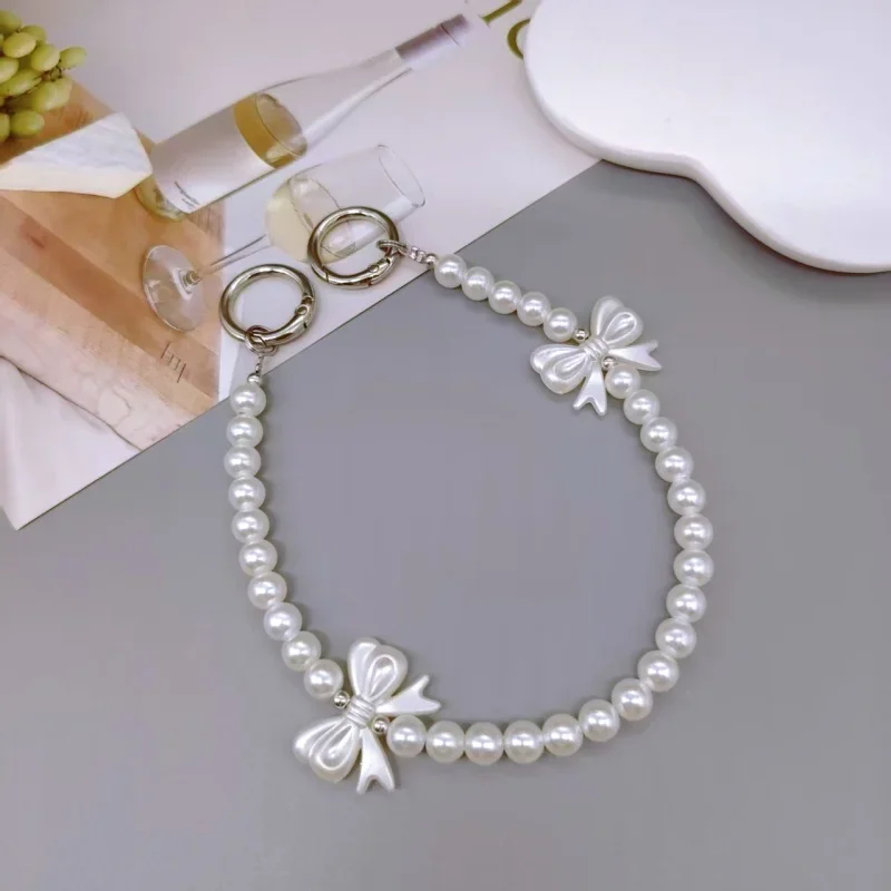 

Elegant Phone Chain with Pearl Beads, Butterfly Knot Pendant, Wrist Strap for Mobile Phones, High-End Style Accessory