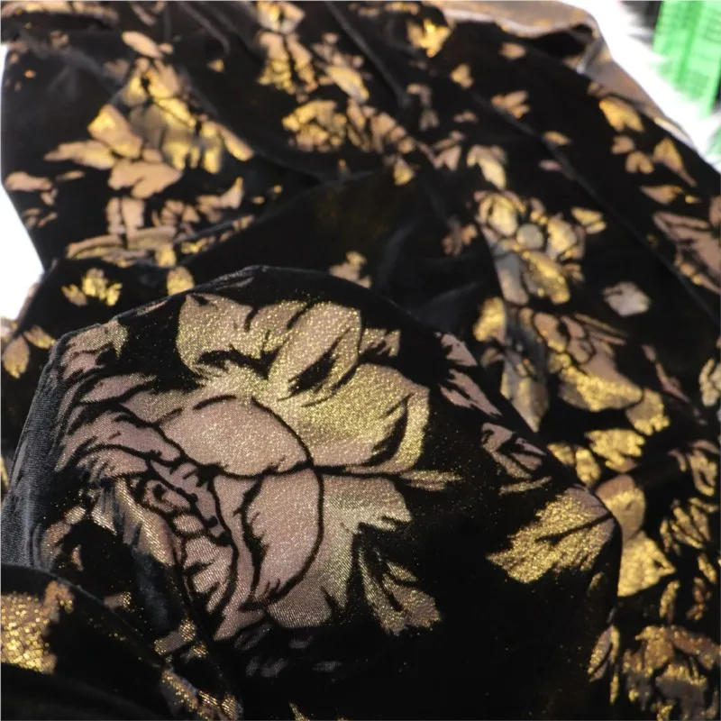 

The fabric of cheongsam dress is made silk-woven golden flower velvet