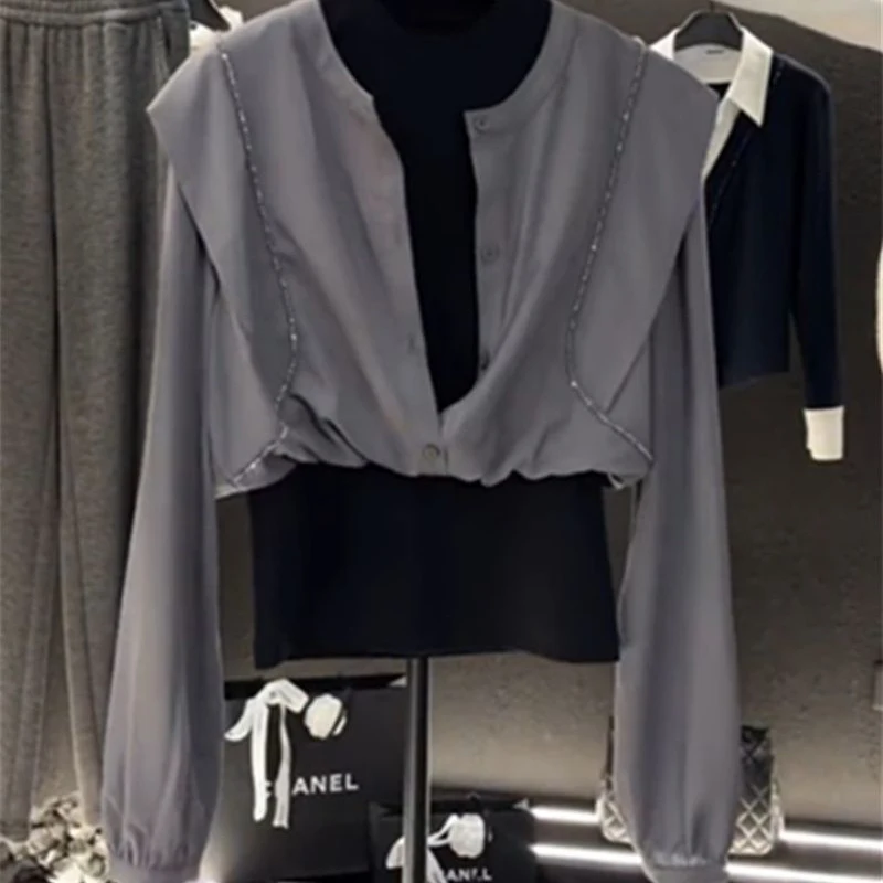 Fake two-piece long-sleeved shirt female summer design sense niche stitching retro temperament Joker fashion slim top.