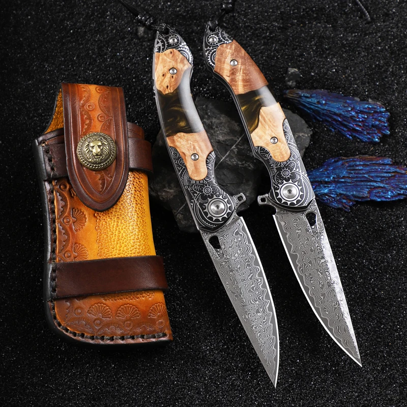 Handcrafted Damascus steel folding knife, suitable for both men and women, comes with a leather sheath and features a resin and maple wood handle. A versatile pocket knife ideal for everyday carry (EDC), camping, adventure, and hiking.