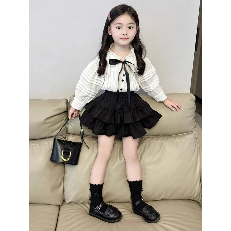 Korean children's clothing new autumn collection: white lace collar bow shirt and black cake skirt two-piece set for girls