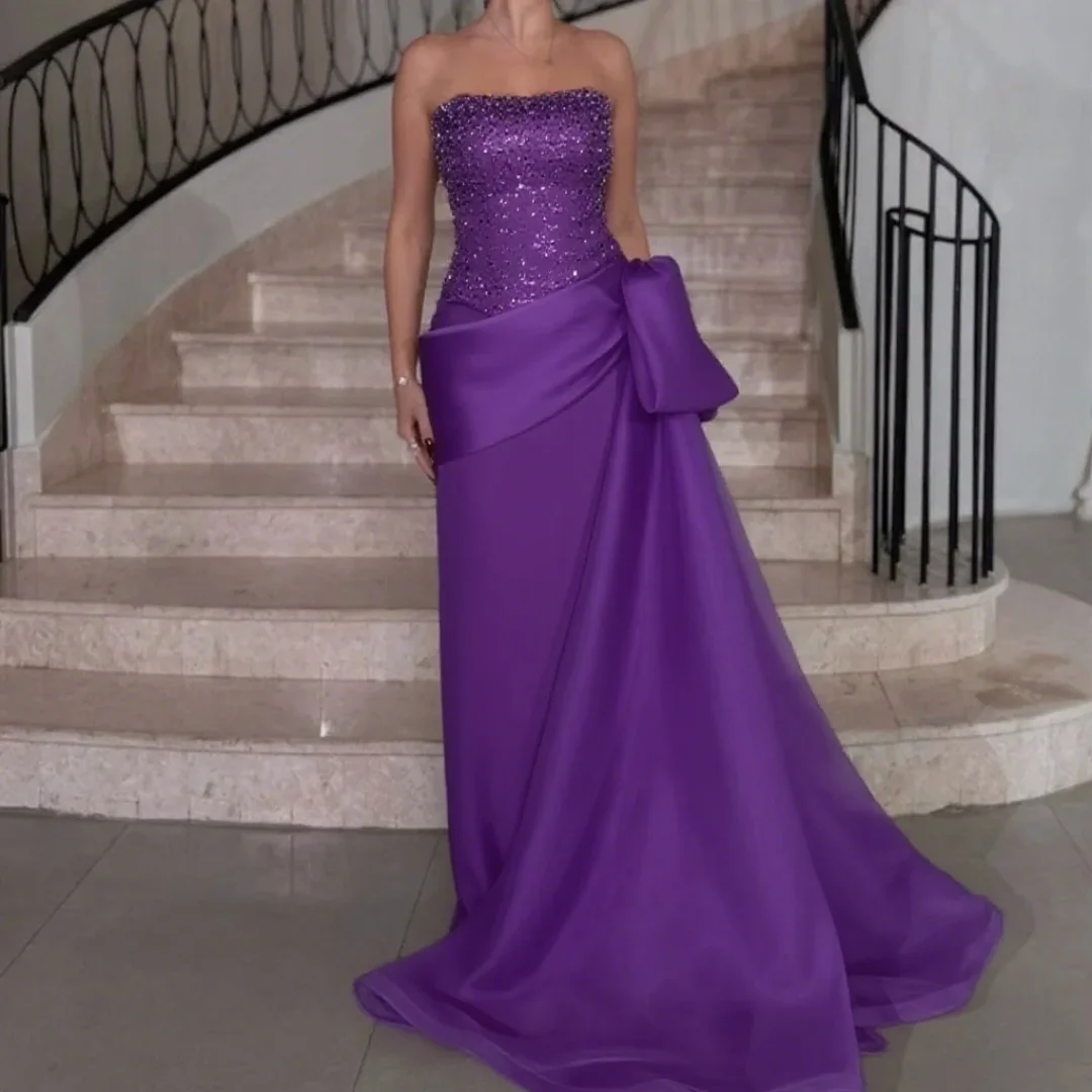 

Customized strapless evening dress with fashionable beaded sequin draping for ladies, suitable for formal evening events.