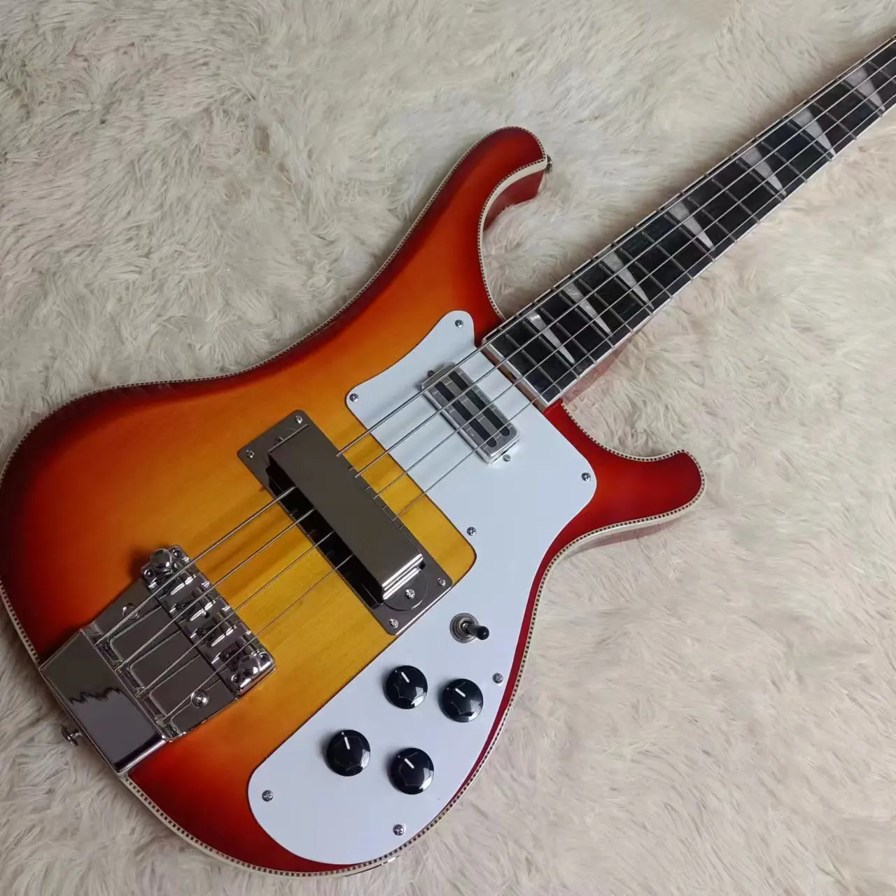 

Factory Customized High-Quality 4-String Electric Guitar Stock For Free Delivery In Orange Color