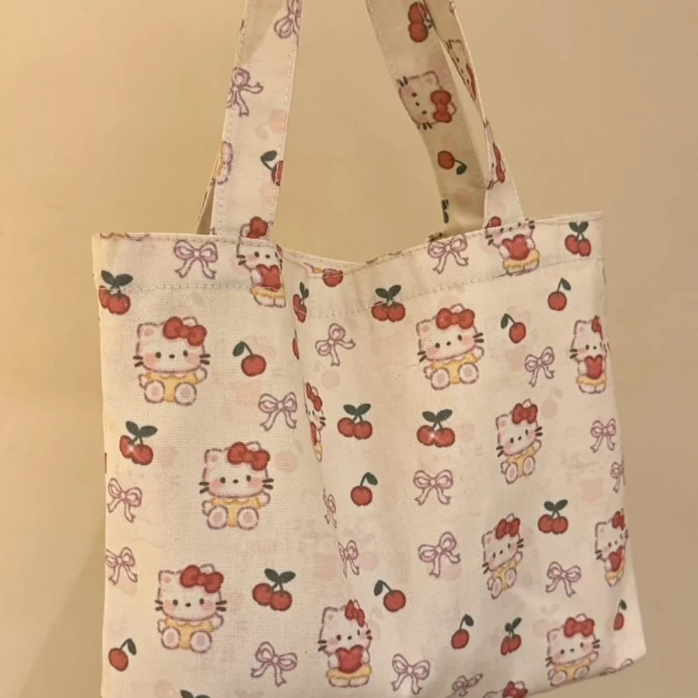 Hello Kitty Handbag with Cute Printed Canvas Shoulder Bag Kawaii Autumn and Winter New Large Capacity Versatile Commuting Bag