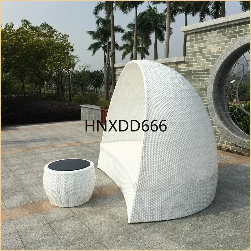 Outdoor rattan chair and coffee table set for leisure in a club, hotel balcony, or garden bed