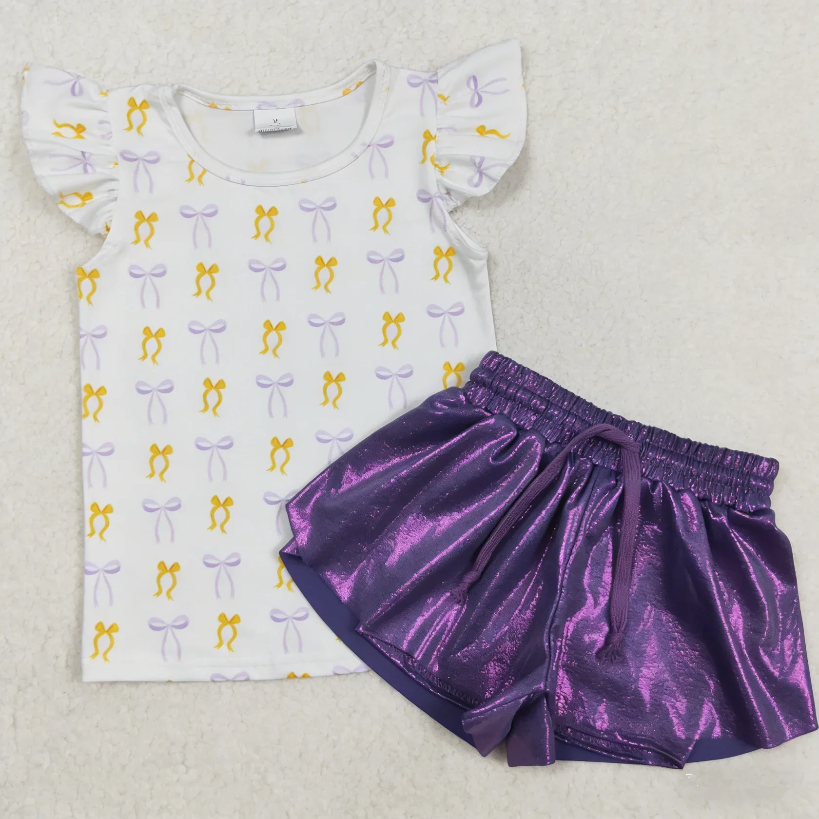 

Оптовый комплект: Фиолетовая футболка с коротким рукавом и бантом для девочек, шорты с рюшами, летняя одежда для малышей и детей