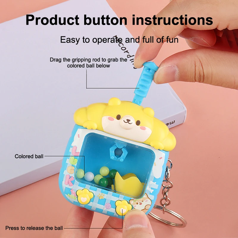 Kreatives Design Ballfangmaschine Schlüsselanhänger Lustiger Kleiner Heimkran-Anhänger Niedliche Rucksack-Dekoration Kindergeschenke