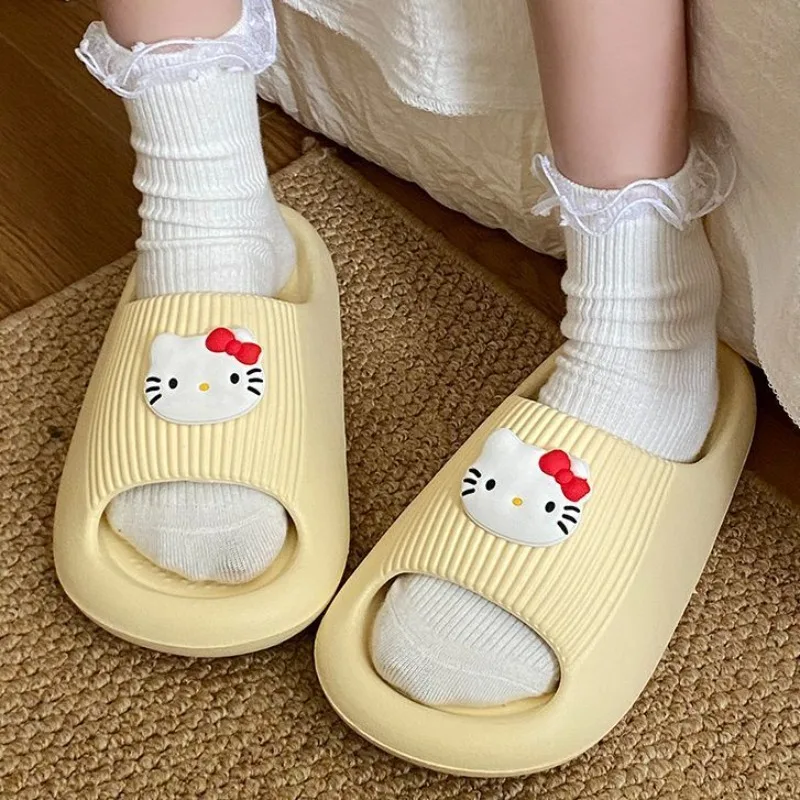 

New Hello Kitty anime peripherals kawaii cute home bathroom EVA flat non-slip slippers can be worn outside as beach sandals.