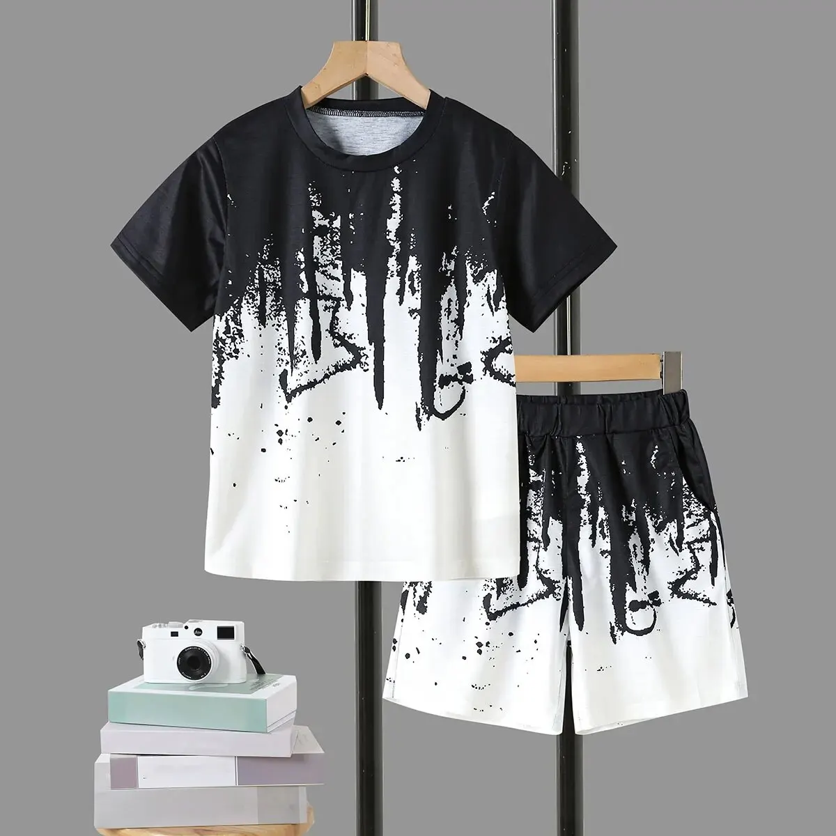 Boys\' Summer Set: Cool Black & White Round-neck T-shirt with Slanted Pocket, Paired with Matching Shorts for Casual Play.