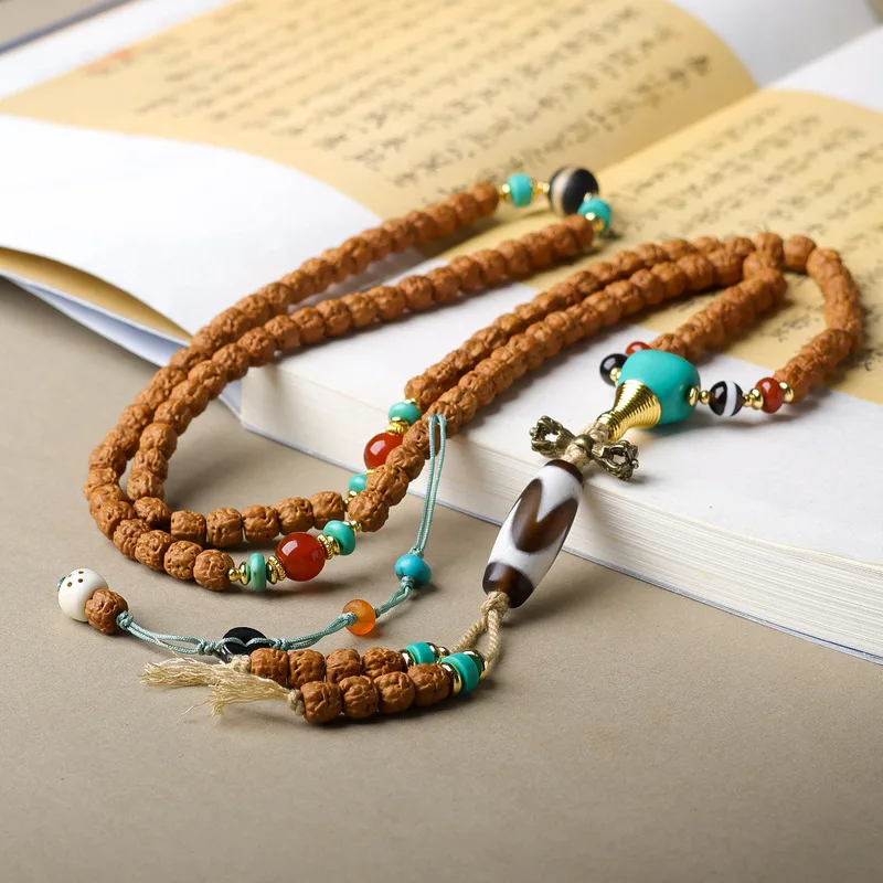 Original Buddhist hand-carved small Rudraksha seed bracelet with tiger tooth beads, turquoise, and three-way connectors in Chine