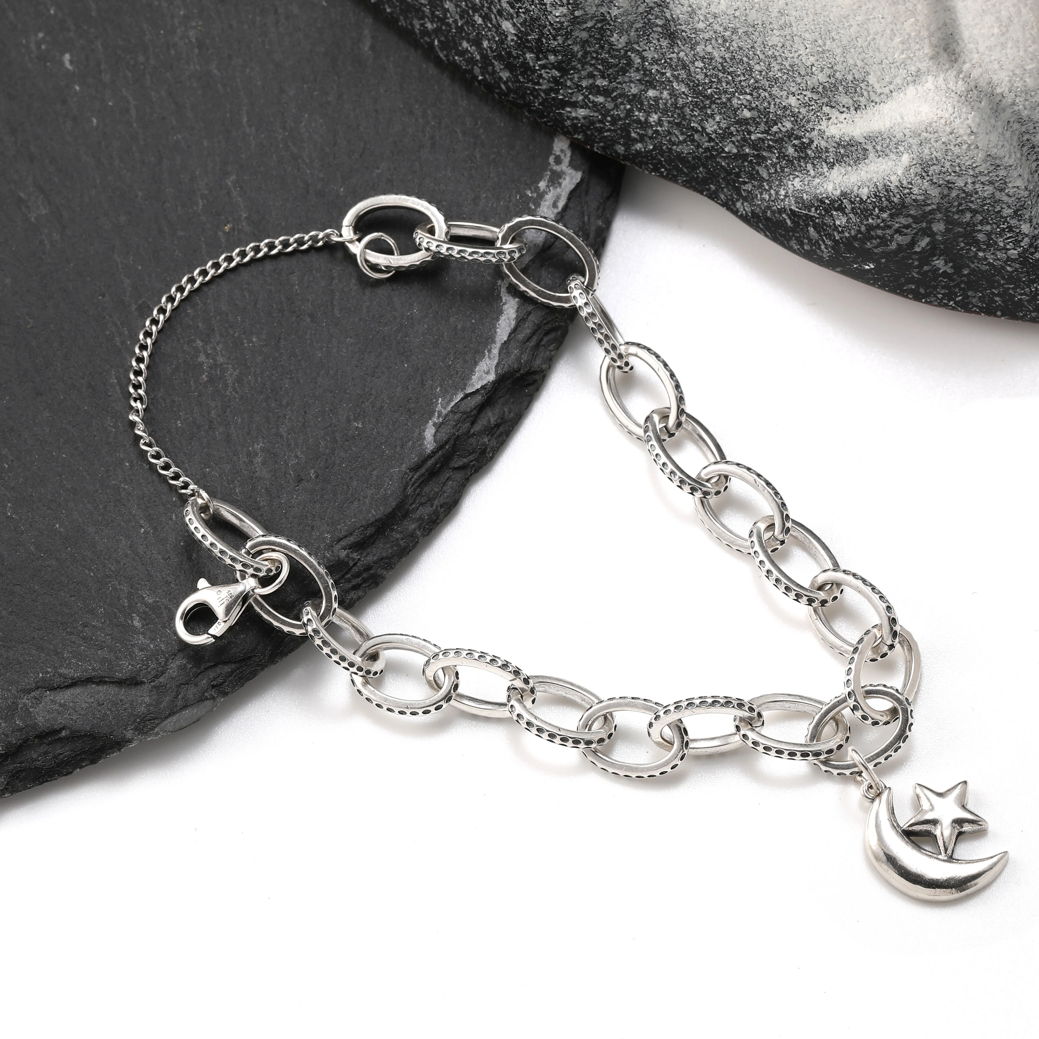 

Genuine 925 sterling silver fashionable and exquisite Textured Oval Charm Bracelet paired with an "at night" pendant
