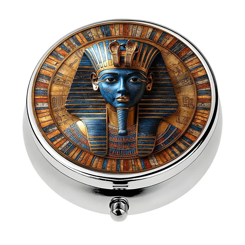 A travel-friendly pill box, single compartment, with three sections, designed with Egyptian motifs. This small decorative pill box is made of metal and can be used as a unique gift. It is a compact storage box, perfect for travel and everyday use.