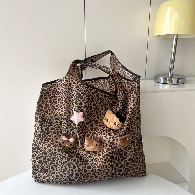 Nuova borsa a tracolla HelloKitty in pelle nera con stampa leopardata borsa carina da pendolarismo estiva da donna di grande capacità