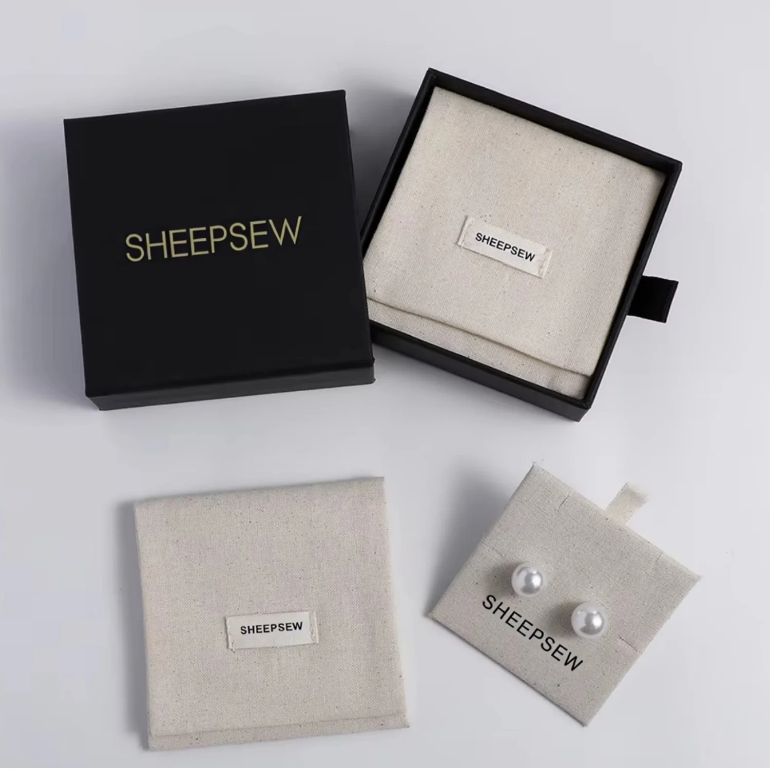 

20 шт., пылезащитный дизайн, изысканные хлопковые сумки для ювелирных изделий, пыленепроницаемые конверты, сумки с внутренней картой для ожерелья, серег, колец S