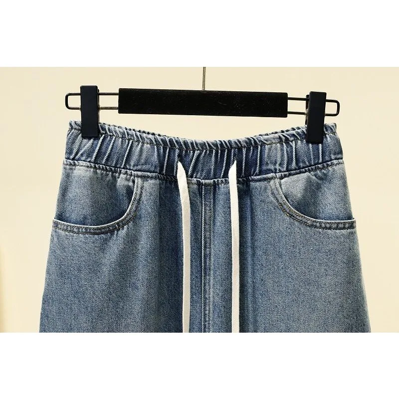 Saia jeans linha A metade do corpo onda coreana feminina, cintura alta, versátil e elegante, comprimento do joelho, monocromática, 2024