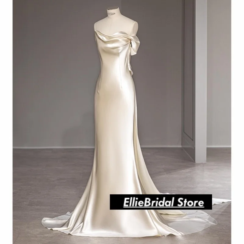 エレガントな白いサテンのストラップレスのイブニングドレス、アフリカの女の子のためのロングバックレスマーメイドプロムドレス、ベスティド・デ・ガラ2025、カスタマイズ可能