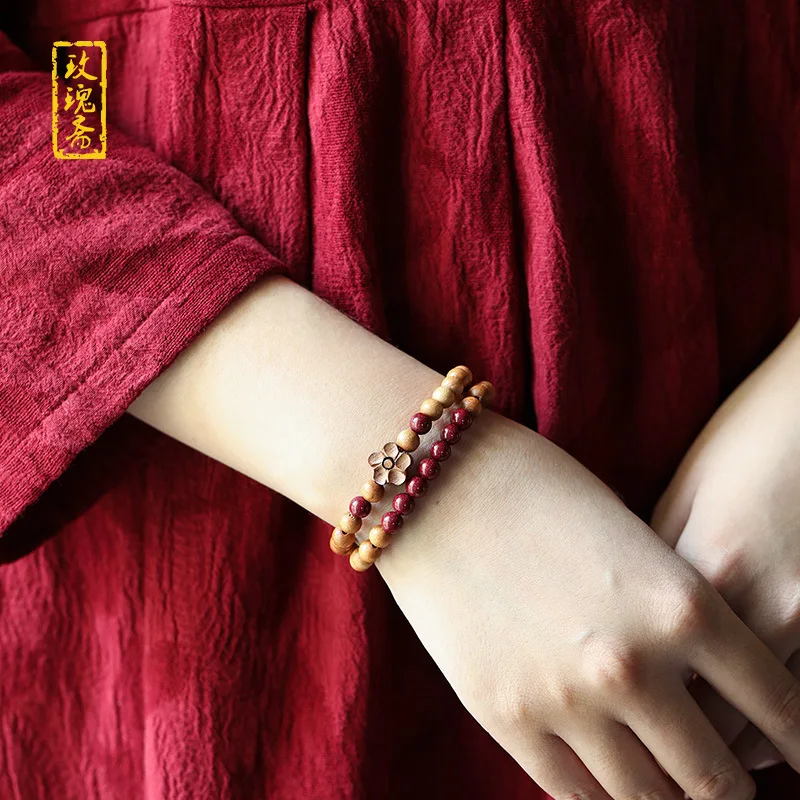 Original design: cinnabar peach wood bracelet with plum blossom motifs featuring a double-strand purple and gold sand desig