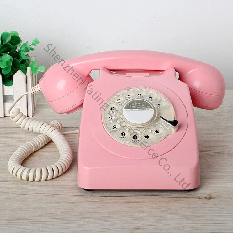 

Metal-ringed fixed-line telephone, retro antique telephone with rotary dial, old-fashioned landline.