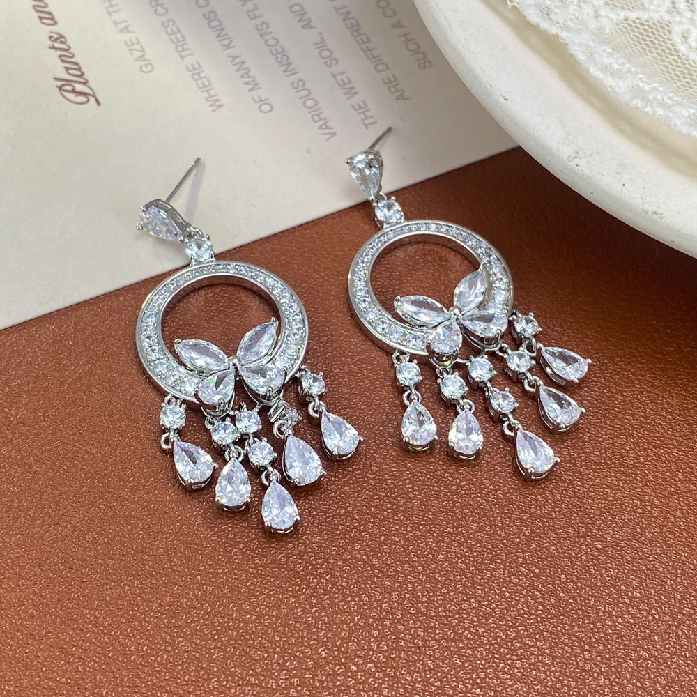 Personalized light luxury zircon round butterfly water drop fringed earrings, super flash earrings.