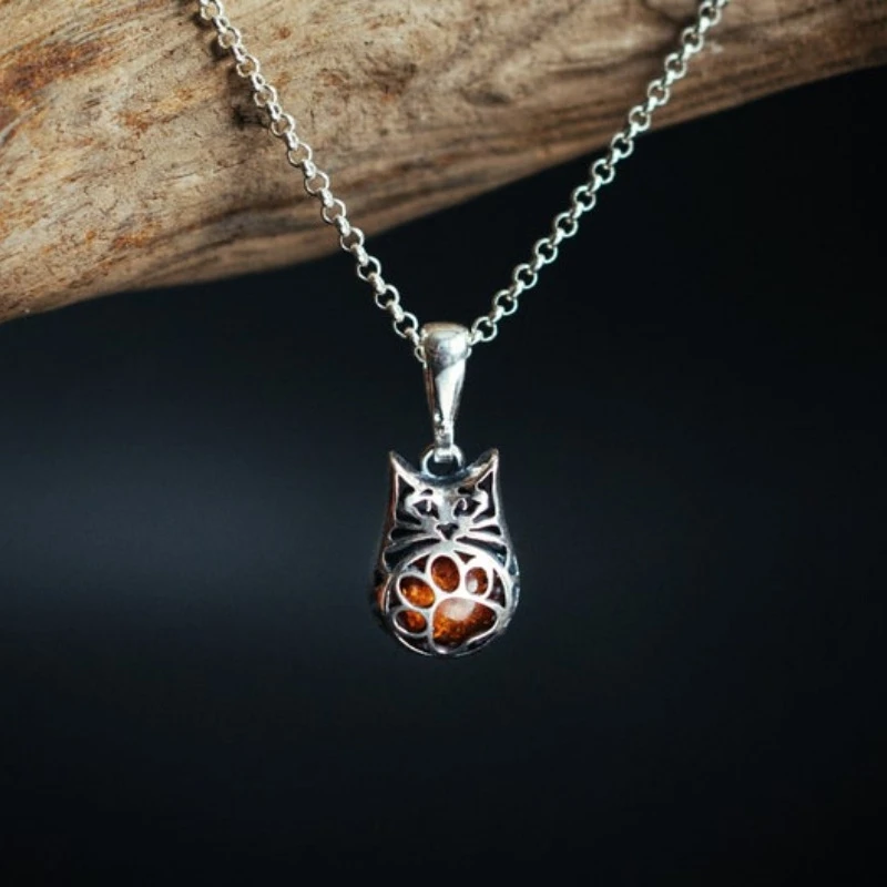 Silver Cat Pendant with Amber Inside and a cute paw on the belly Openwork  kitten Gift for cat lovers Three dimensions pet