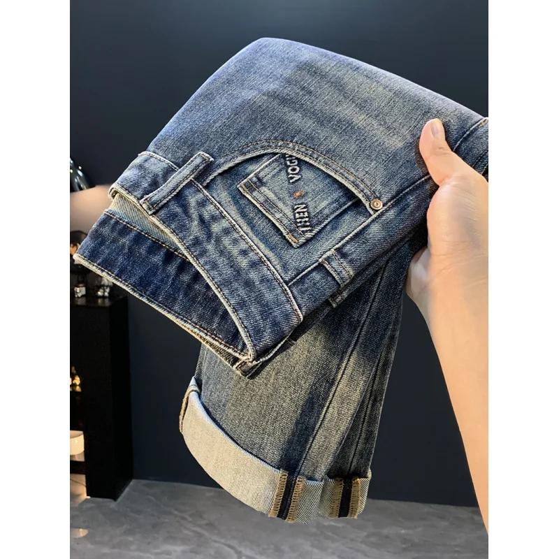 جينز جديد لخريف 2025 عالي الجودة فضفاض ومستقيم الساق للرجال موضة شارع العليا متعدد الاستخدامات النسخة الكورية سراويل تقليدية