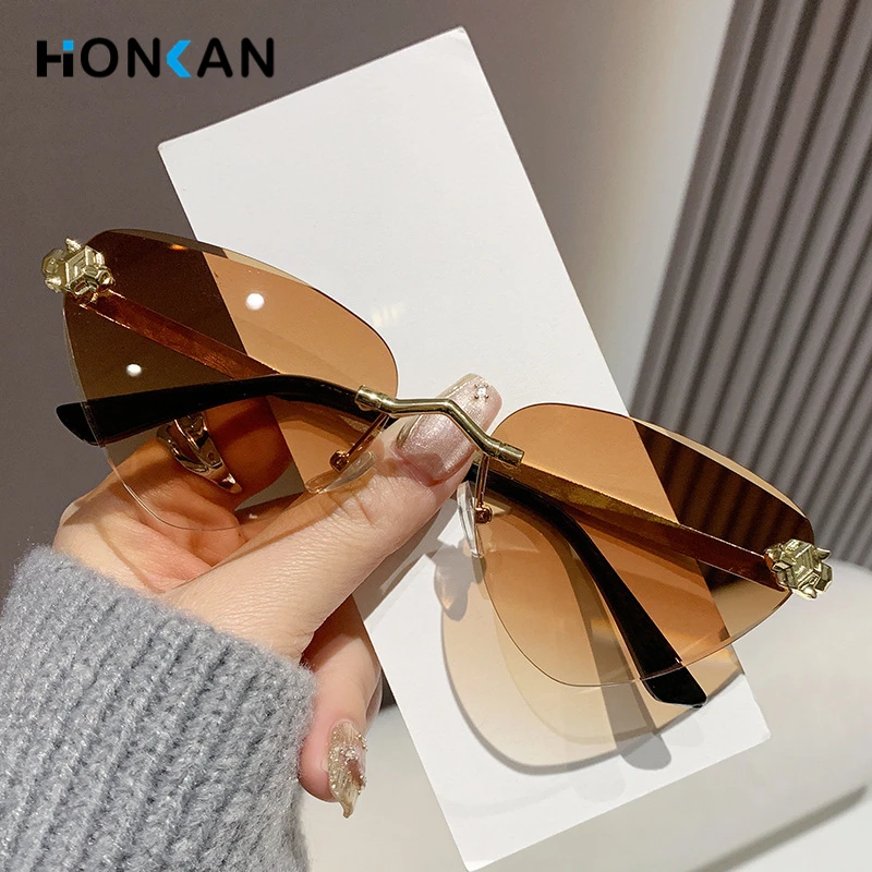 

Fashion Frameless Cut Edge Sunglasses Triangle Cat Eye Metal Sunglasses Women UV Resistant Small Frame UV400 Sunglasses New