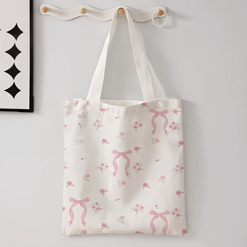 A Pink bow and small flower pattern printed canvas tote bag,