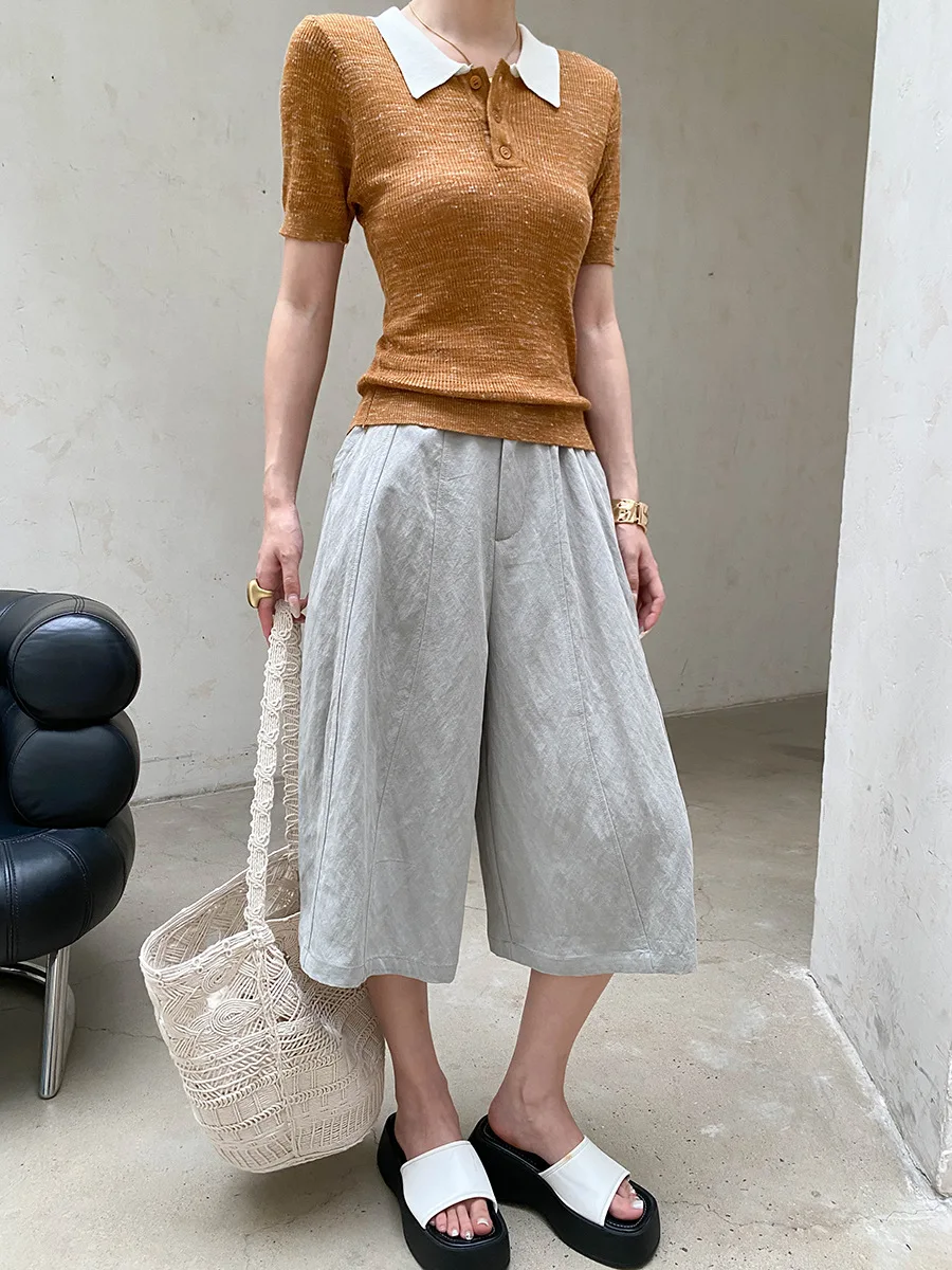 Sommerliche Damen-Freizeithose in einfarbigem Design mit lockerem Schnitt und hohem Bund und weitem Bein. – Detail 34