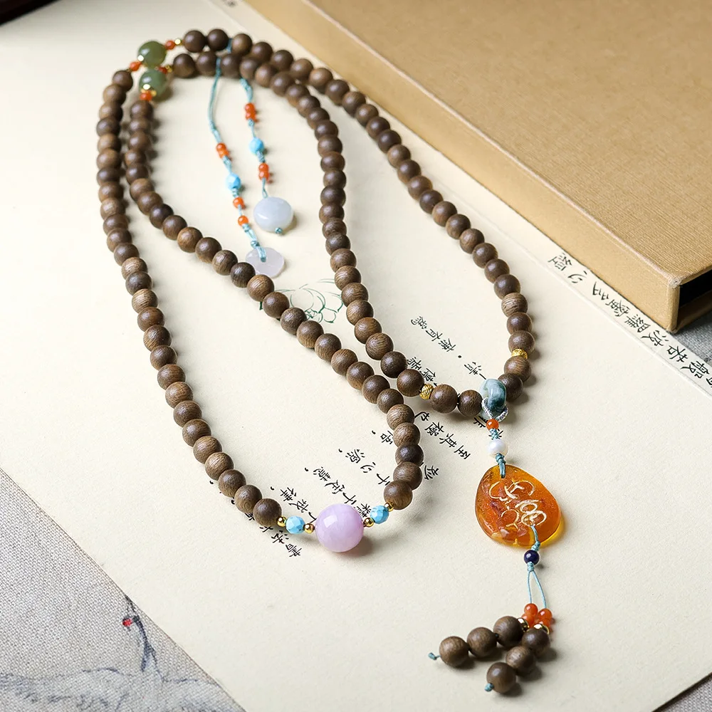 

Original design: Huang Qinan agarwood multi loop bracelet art play honey wax jadeite and Tian Yuzi Li Hui Buddha beads necklace