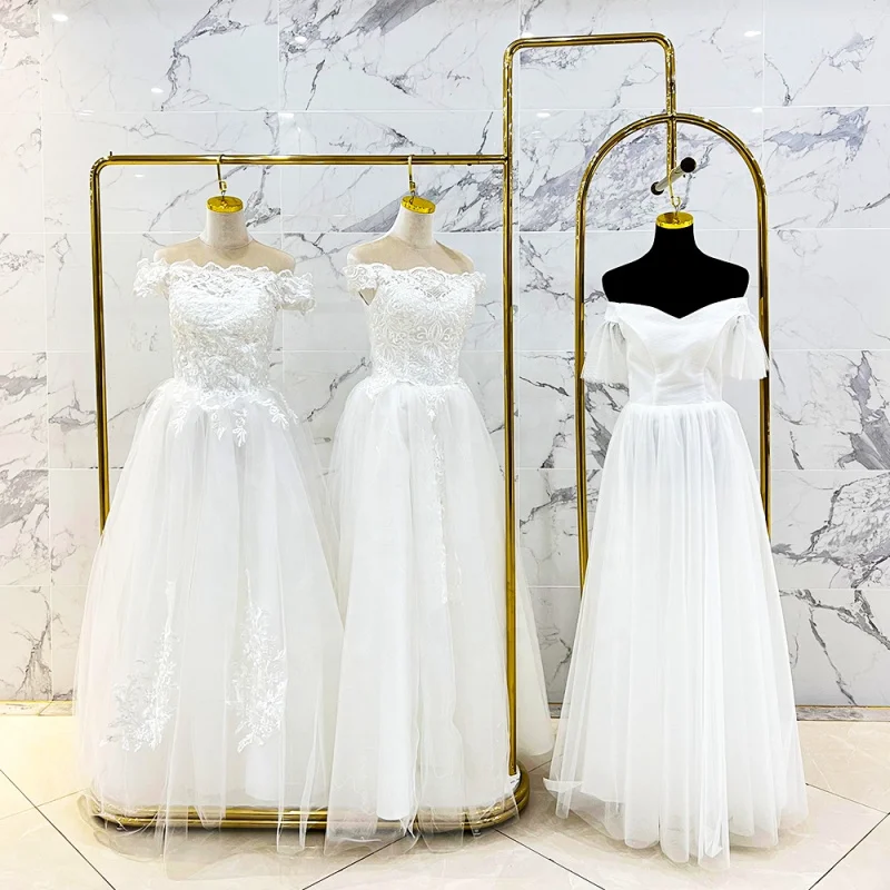 

customized.Guangzhou Golden Clothing Gowns Bridal Display Rack Customize Display Stand Wedding Dress