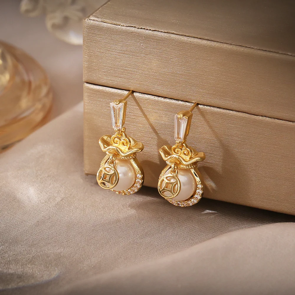 

High-end pearl lucky bag earrings, light luxury and versatile, micro-paved zircon earrings, niche design earrings for women