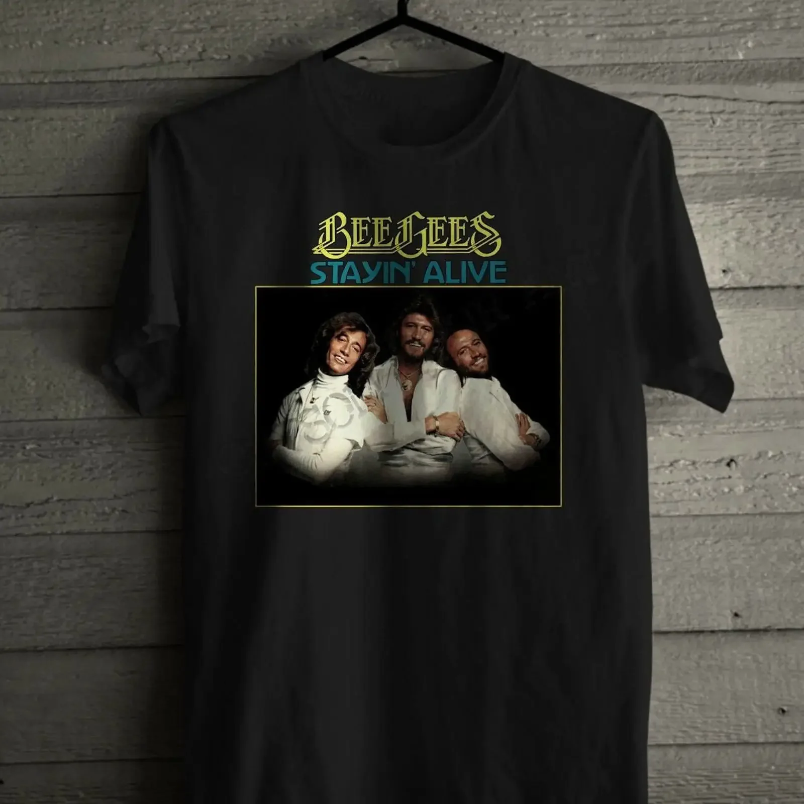 May include Black t shirt with a graphic of the Bee Gees band members and text Stayin' Alive vintage Washed Versatile Unisex