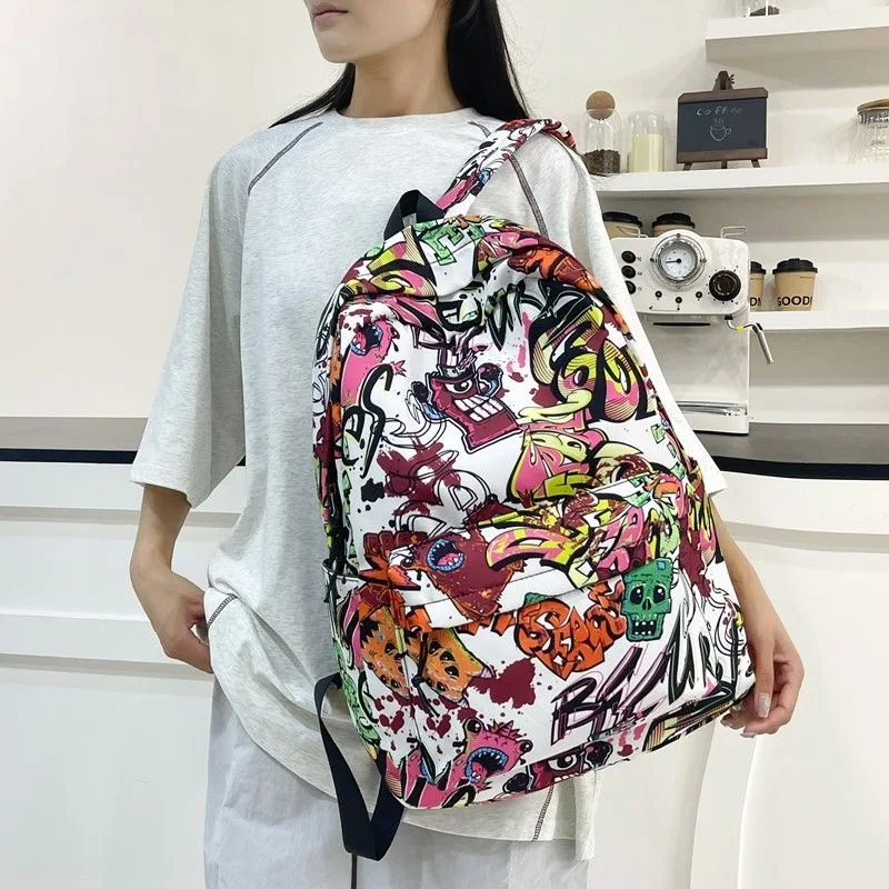 Zaino Graffiti alla moda Zaino per studenti adolescenti di grande capacità Zaino da viaggio popolare da strada per uomo e donna con stampa di lettere dei cartoni animati