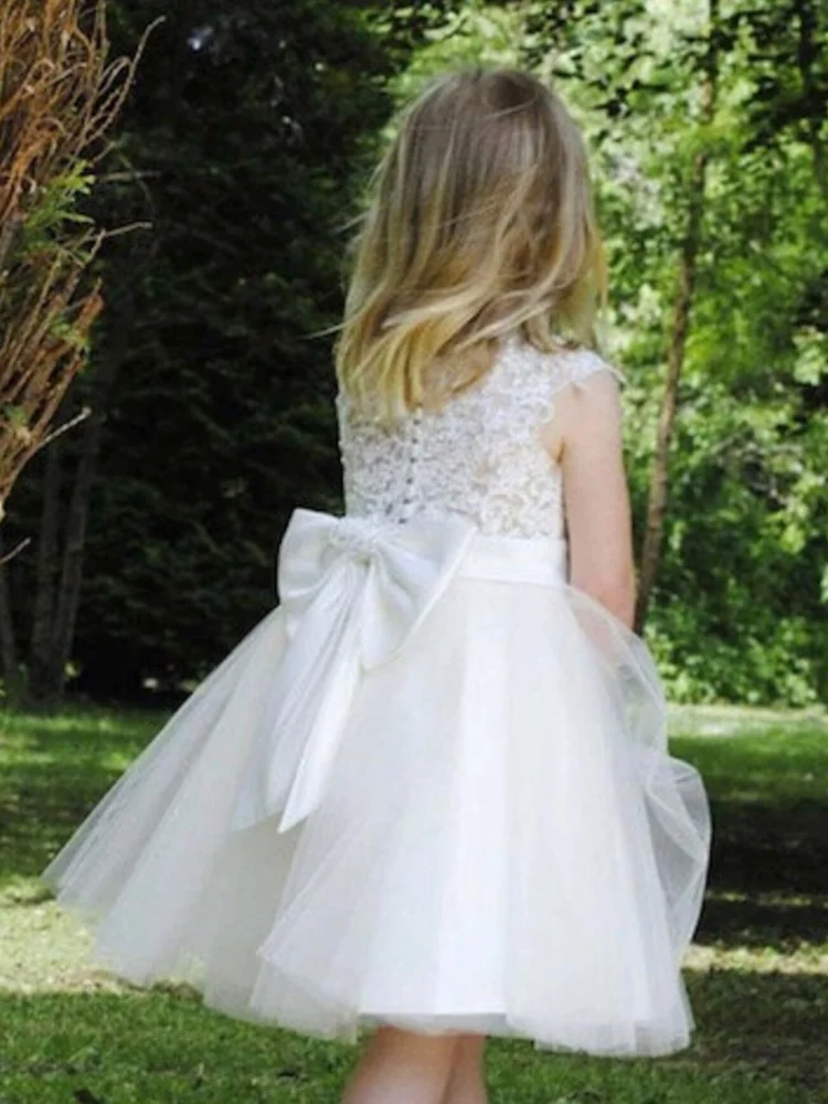 Abiti da ragazza di fiori bianchi Tulle Puffy Appliques con fiocco senza maniche per abiti da prima comunione da spettacolo di compleanno di nozze