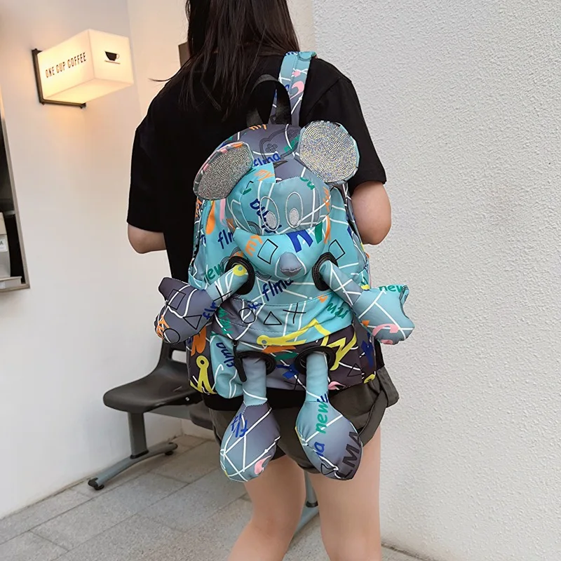 

Trendy Alphabet Graffiti Diamond Backpack Cartoon Doll Cool Backpack Large Capacity high quality Backpack for Men and Women