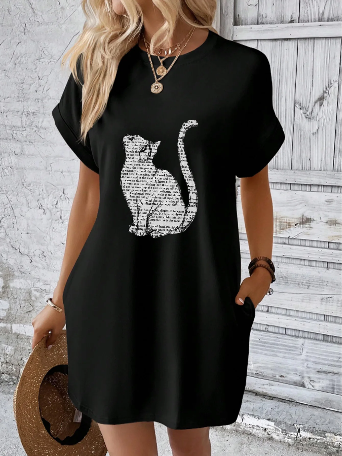 

Women's high-end black crew neck dress, premium Sorona fabric, with newspaper text cat print.