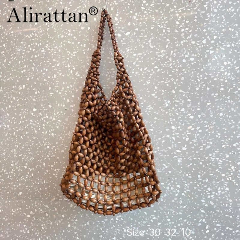 

Alirattan 2026 New Wooden Bead Woven Handbag Vintage Double Bamboo Handle Hollow Bucket Bag Large Capacity Commuting Women Cluth