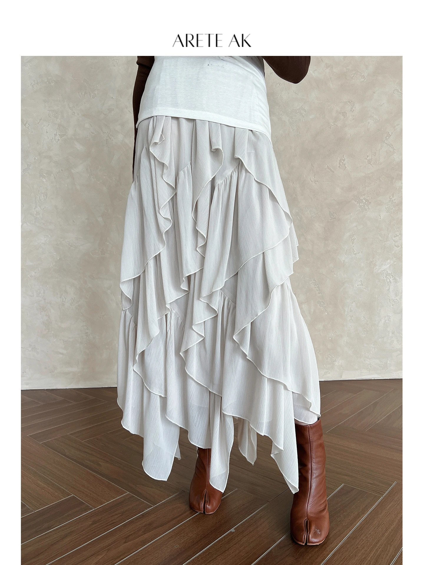 

Ретро-юбка с асимметричным подолом для женщин, ранняя весна, стройнящий дизайн, уникальная длинная юбка из полиэстера, повседневный стиль, с дизайнерской отделкой на талии