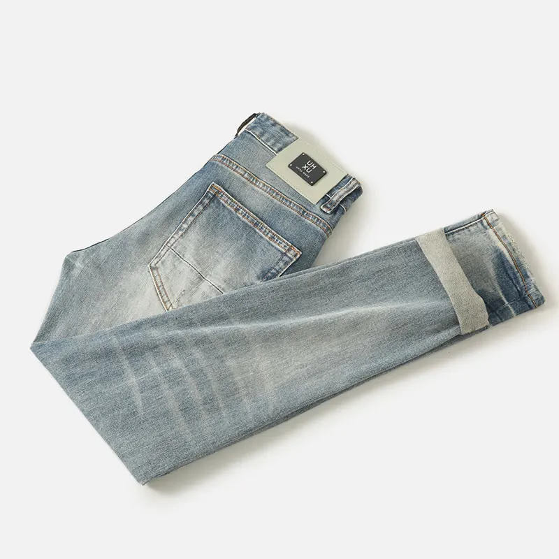 Fashionadesigner mode nieuwe herenjeans met kras, rimpel, borduurwerk, nostalgische stretch, slim fit, retro gewassen, lichtblauw