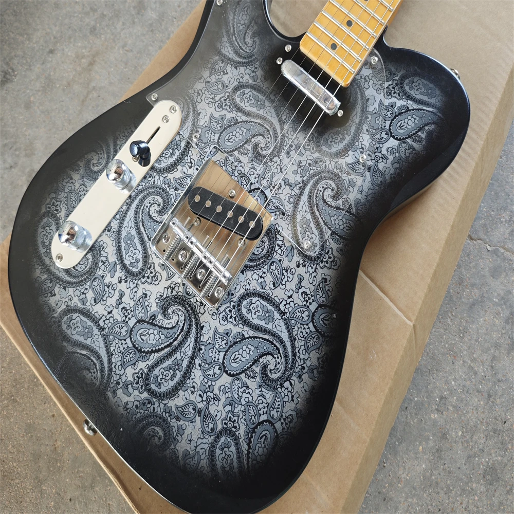 

Left-hand electric guitar, black and grey coral body, SS pickups