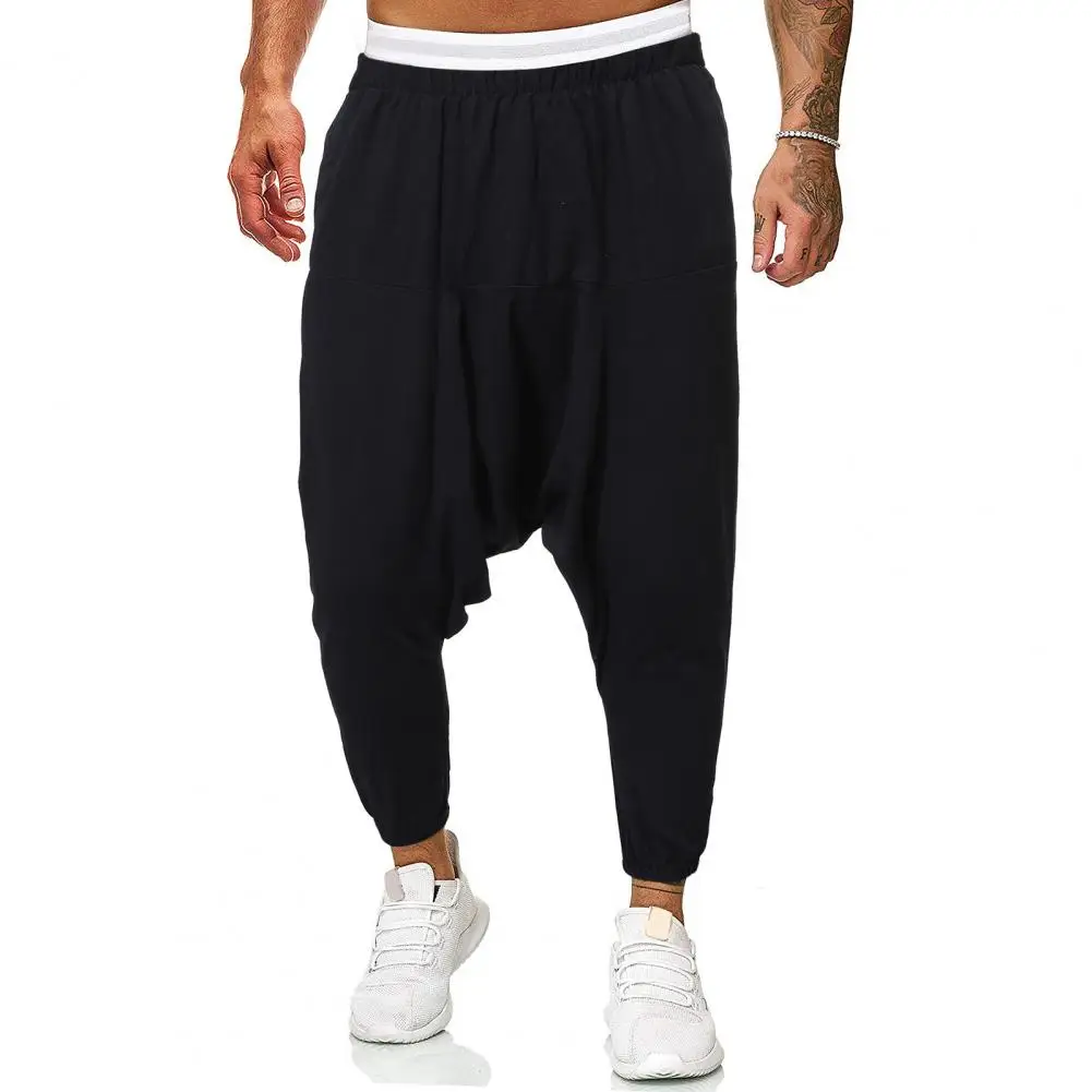 

Deep Crotch Men Harem Pants Solid Color Ankle-banded Baggy Loose Elastic Waist Ankle-tied Pleated Sweatpants Men Baggy Trousers