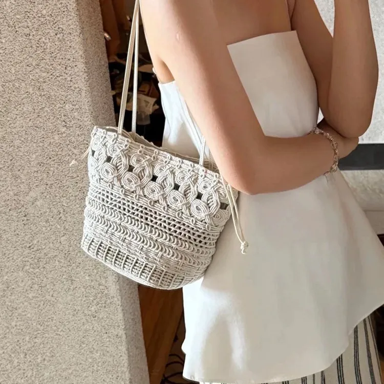 

2026 spring and summer new hand-woven large-capacity tote bag lazy vacation style straw woven hollow bucket shoulder bag